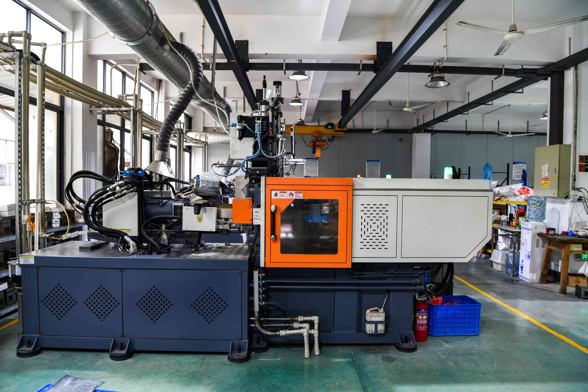 Injection molding equipment used to produce polymer eyewear frame components